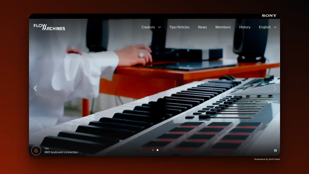 A person in a white shirt uses a laptop on a wooden desk, with a MIDI keyboard in the foreground. The screen displays the Flow Machines website interface, showcasing how AI in Songwriting can revolutionize creativity and offer dynamic navigation options for aspiring musicians.